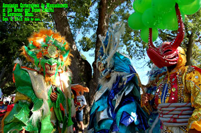 Two diablos cojuelos and one lechone, Carnival comparsa, ; Asociacion Carnavalesca de Massachusetts; Lawrence, Massachusetts; Photography by Gregory Cook