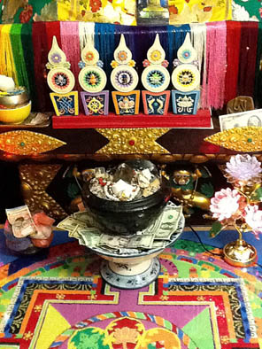 Torma offering in front of deity, Tibetan torma maker, 2009; Khenpo Chopel; Arlington, Massachusetts; Oatmeal, butter, wax, paint;