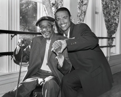 James Godbolt "Dr. Jimmy Slyde" (sitting) and Edward Mendes III "Rocky Mendes", Rhythm tap dance, 2007; Hanson, Massachusetts; Photography by Tom Pich