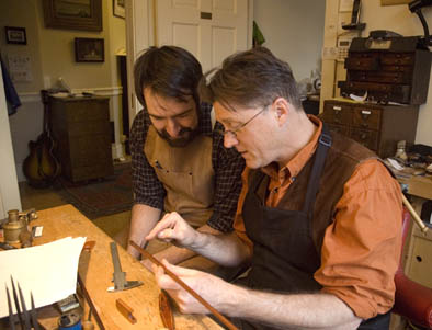 David Hawthorne teaching Joel Pautz, Bow maker, 2012; Cambridge, Massachusetts; Photography by Maggie Holtzberg