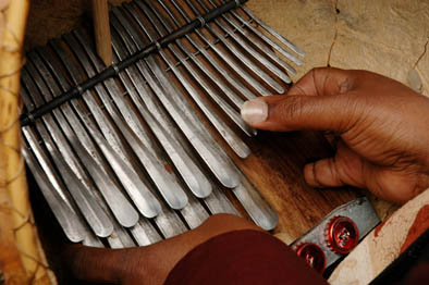 Playing the mbira. Photography by Jeff Crandall, Musician, 2008; Solomon Murungu; Bolton, Massachusetts;