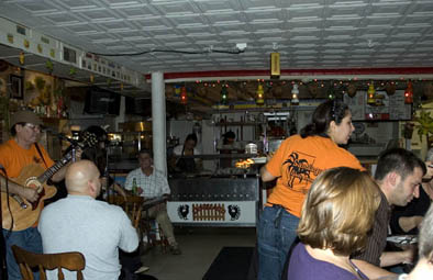 Members of Grupo Canela performing at Santiago's Family Restaurant, Puerto Rican musicans and foodways, 2008; Grupo Canela; Westfield, Massachusetts; Photography by Maggie Holtzberg
