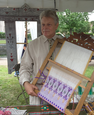 Jonas Stundzia holding a frame used in pick-up weaving, Lithuanian pick-up weaving, 2015; Jonas Stundzia; Lowell, Massachusetts; Photography by Maggie Holtzberg
