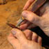 Close up of chiseling out mortise; bow maker; 2011; David Hawthorne; Cambridge, Massachusetts; wood, ivory, metal thread