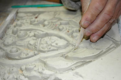 Carving design in clay; Apprenticeship - Cambodian ornaments; 2011: Lowell, Massachusetts; Clay; 20 x 14 in.