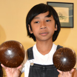 Maddox Yang doing coconut dance; Cambodian folk dance; 2019: Lowell, Massachusetts